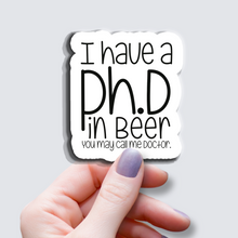 Load image into Gallery viewer, I have a Ph.D in Beer... - Vinyl Sticker
