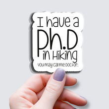 Load image into Gallery viewer, I have a Ph.D in Hiking... - Vinyl Sticker
